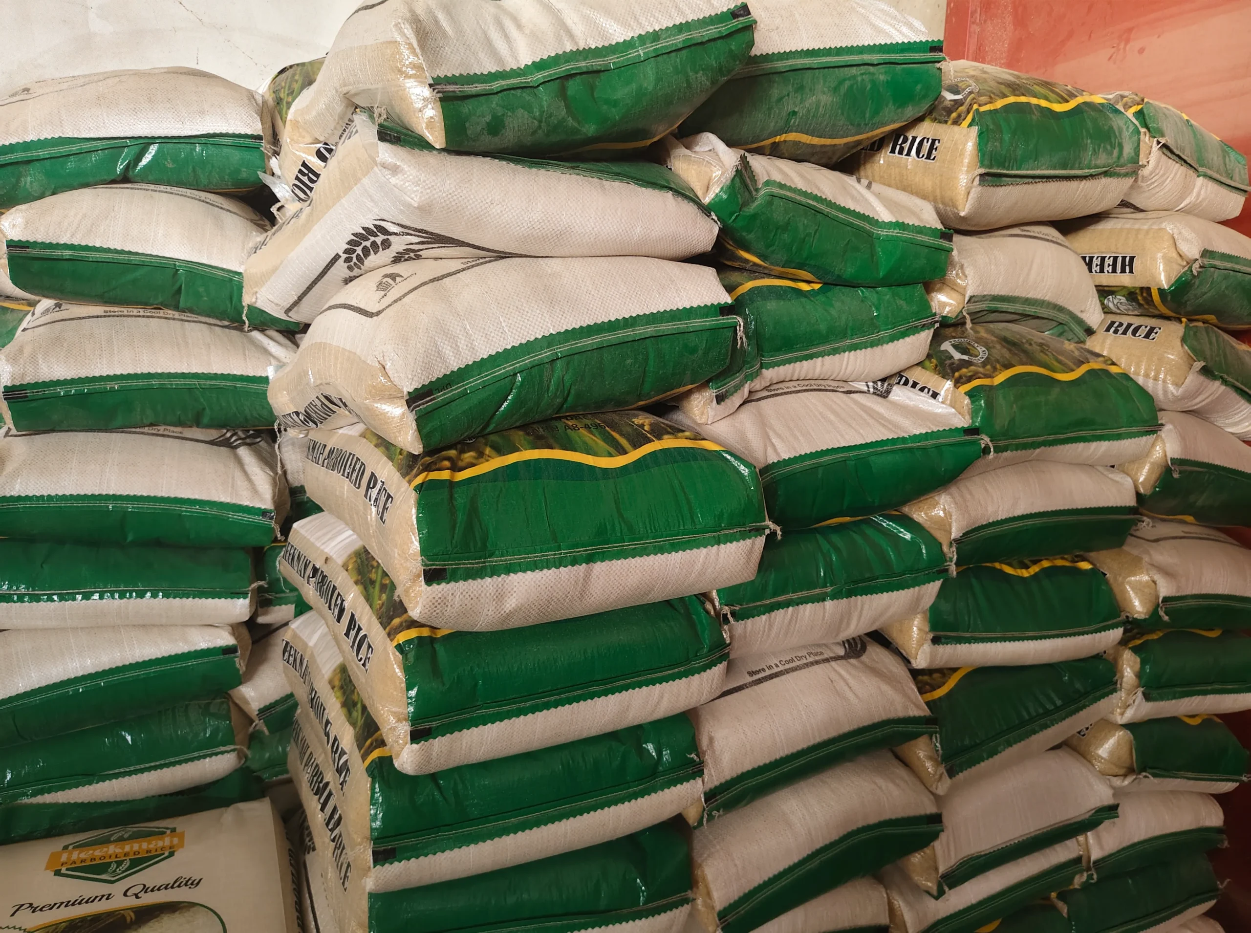 Stacked bags of Heekmah Rice ready for distribution